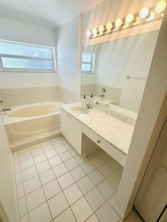 6455 NW Foxglove St, Port Saint Lucie, FL 34986 - bathroom with a garden tub, tile patterned floors, and vanity