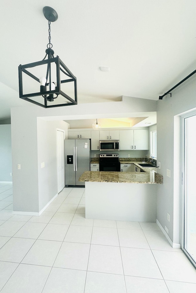 6455 NW Foxglove St, Port Saint Lucie, FL 34986 - kitchen featuring stainless steel appliances, a chandelier, a peninsula, and plenty of natural light