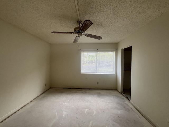 441 Pine Glen Ln Unit B1, Greenacres, FL 33463 - empty room featuring a ceiling fan, concrete flooring, and a textured ceiling