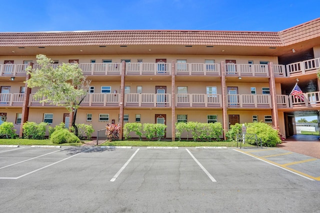9700 Sunrise Lakes Blvd Unit 305, Sunrise, FL 33322 - view of apartment building / complex featuring uncovered parking