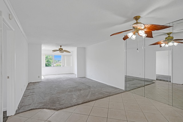 9700 Sunrise Lakes Blvd Unit 305, Sunrise, FL 33322 - empty room featuring ceiling fan, light colored carpet, light tile patterned flooring, and crown molding