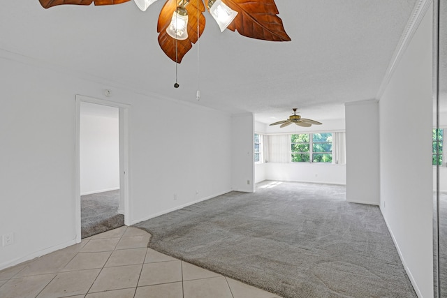 9700 Sunrise Lakes Blvd Unit 305, Sunrise, FL 33322 - spare room with light carpet, ornamental molding, light tile patterned floors, and ceiling fan