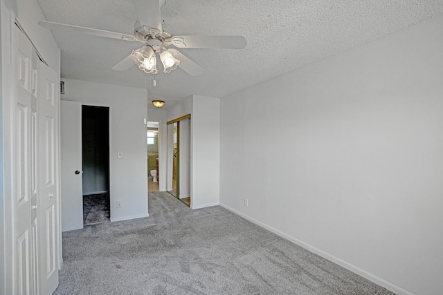 9700 Sunrise Lakes Blvd Unit 305, Sunrise, FL 33322 - unfurnished bedroom featuring carpet flooring, a textured ceiling, and ceiling fan