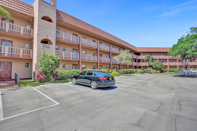 9700 Sunrise Lakes Blvd Unit 305, Sunrise, FL 33322 - view of apartment building / complex featuring uncovered parking