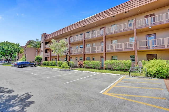9700 Sunrise Lakes Blvd Unit 305, Sunrise, FL 33322 - view of building exterior featuring uncovered parking