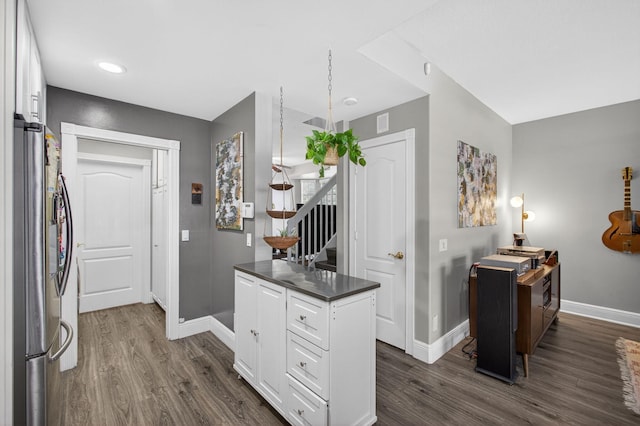 274 Murray Ct, Jupiter, FL 33458 - kitchen featuring freestanding refrigerator, dark wood finished floors, white cabinets, dark countertops, and recessed lighting