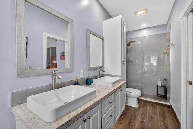 274 Murray Ct, Jupiter, FL 33458 - bathroom featuring wood finished floors, a shower stall, and double vanity