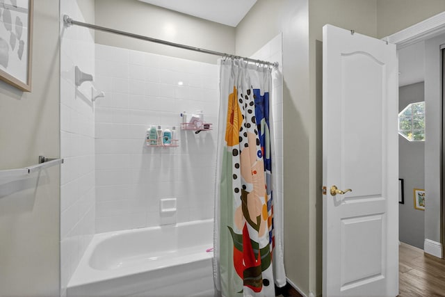 274 Murray Ct, Jupiter, FL 33458 - bathroom featuring shower / bath combo and wood finished floors