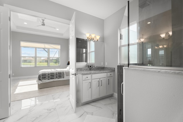 12136 SW Fortezza Way, Port Saint Lucie, FL 34987 - bathroom with vanity, ensuite bathroom, a walk in shower, marble look tiles, and ceiling fan