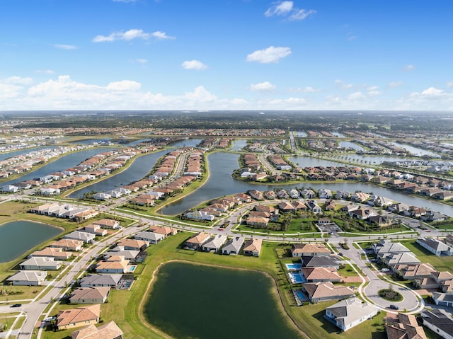 12136 SW Fortezza Way, Port Saint Lucie, FL 34987 - aerial overview of property's location with nearby suburban area and a large body of water