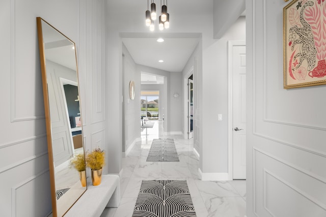 12136 SW Fortezza Way, Port Saint Lucie, FL 34987 - hall featuring light marble finish flooring, a chandelier, and recessed lighting