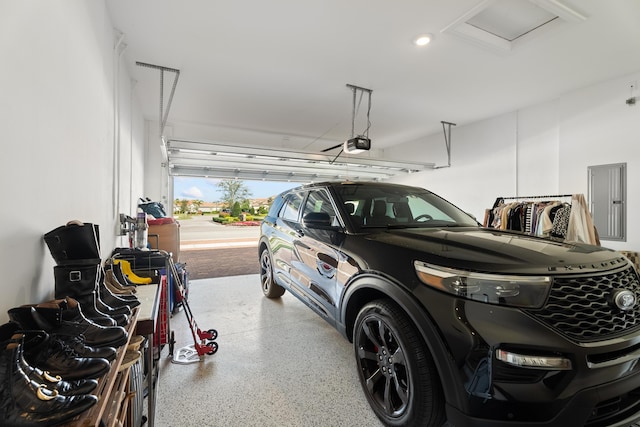 12136 SW Fortezza Way, Port Saint Lucie, FL 34987 - garage with a garage door opener and electric panel