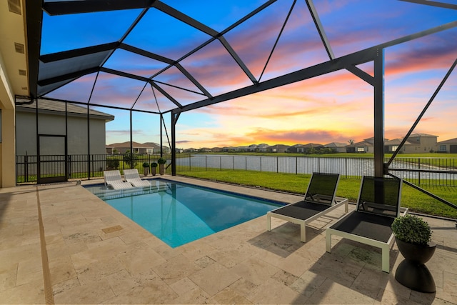12136 SW Fortezza Way, Port Saint Lucie, FL 34987 - pool at dusk with a patio, a residential view, and glass enclosure
