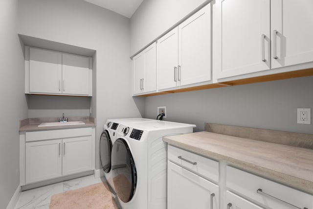 12136 SW Fortezza Way, Port Saint Lucie, FL 34987 - laundry area with cabinet space, washer and dryer, and light marble finish floors