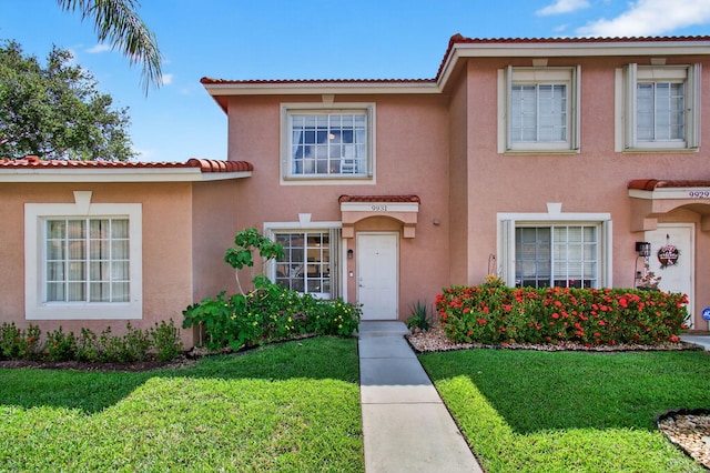 9931 Kamena Cir, Boynton Beach, FL 33436 - view of front facade featuring a front lawn and stucco siding