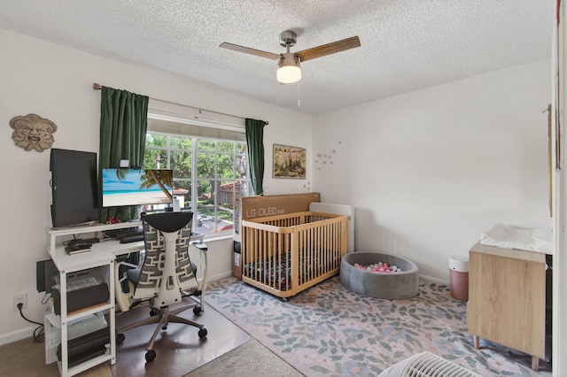 9931 Kamena Cir, Boynton Beach, FL 33436 - carpeted bedroom featuring a textured ceiling, an office area, and a ceiling fan