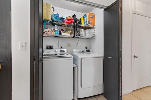 9931 Kamena Cir, Boynton Beach, FL 33436 - laundry area featuring separate washer and dryer and light tile patterned flooring