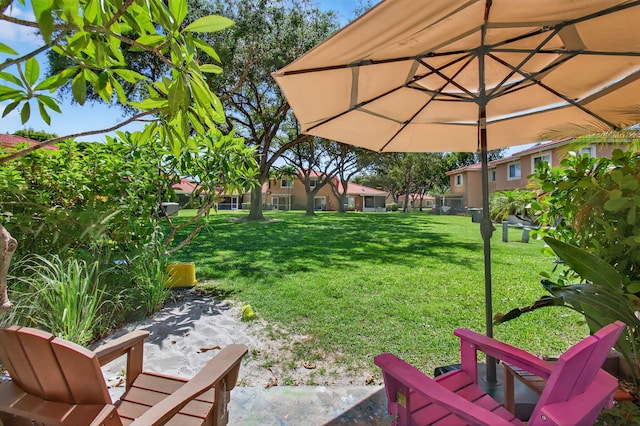9931 Kamena Cir, Boynton Beach, FL 33436 - view of green lawn with a patio