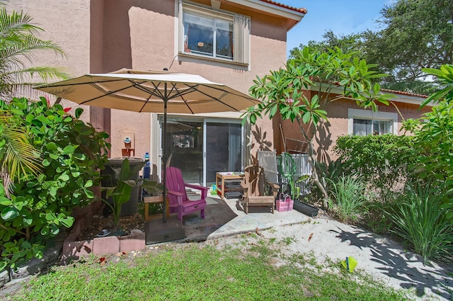 9931 Kamena Cir, Boynton Beach, FL 33436 - back of house featuring stucco siding and a patio