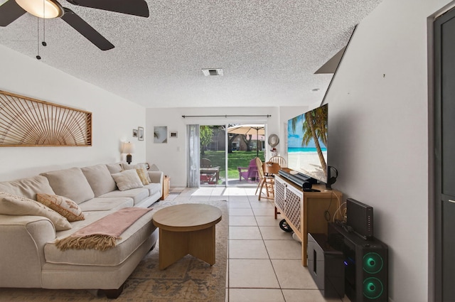 9931 Kamena Cir, Boynton Beach, FL 33436 - living room featuring a ceiling fan, light tile patterned flooring, and a textured ceiling
