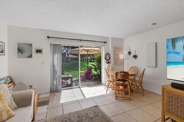 9931 Kamena Cir, Boynton Beach, FL 33436 - dining area featuring a textured ceiling and light tile patterned flooring