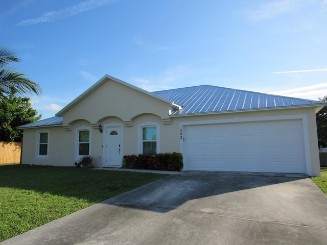 1482 SE Kirke Ln, Port Saint Lucie, FL 34983 - ranch-style house with stucco siding, a metal roof, driveway, and a front yard