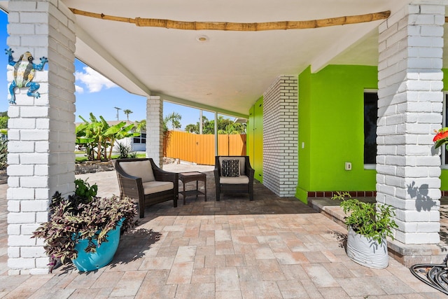 5203 S Indian River Dr, Fort Pierce, FL 34982 - view of patio / terrace featuring a gate