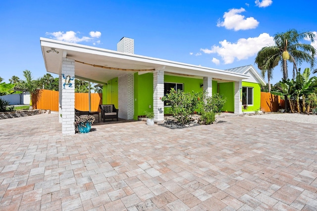 5203 S Indian River Dr, Fort Pierce, FL 34982 - view of front of home with a chimney