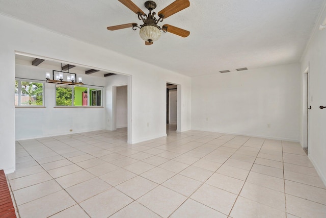5203 S Indian River Dr, Fort Pierce, FL 34982 - unfurnished room with a chandelier, light tile patterned flooring, and ceiling fan