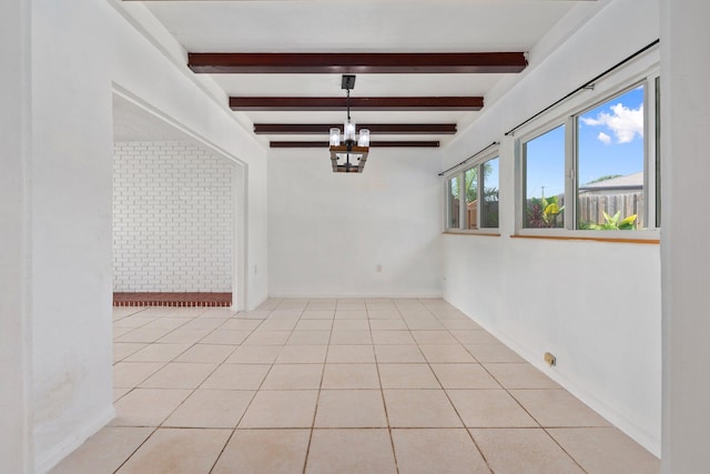 5203 S Indian River Dr, Fort Pierce, FL 34982 - unfurnished dining area featuring beamed ceiling, a chandelier, and light tile patterned floors