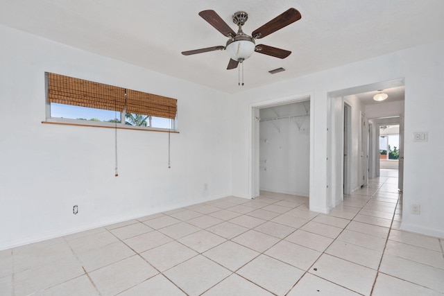 5203 S Indian River Dr, Fort Pierce, FL 34982 - unfurnished bedroom with light tile patterned floors and a ceiling fan