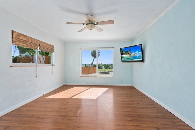5203 S Indian River Dr, Fort Pierce, FL 34982 - unfurnished room featuring crown molding, a ceiling fan, wood finished floors, and a textured ceiling