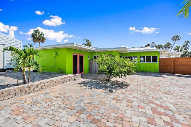 5203 S Indian River Dr, Fort Pierce, FL 34982 - mid-century inspired home with board and batten siding and a chimney