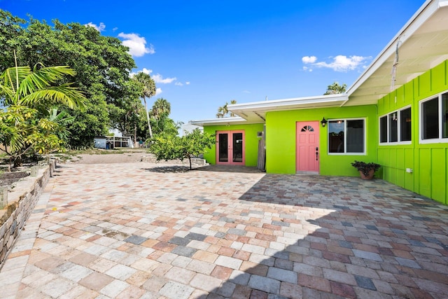 5203 S Indian River Dr, Fort Pierce, FL 34982 - view of patio / terrace featuring french doors