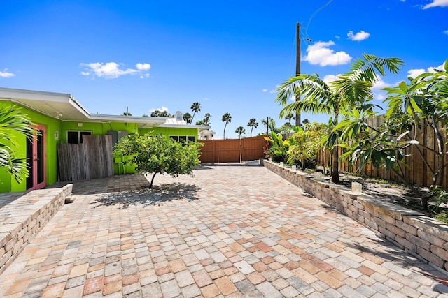 5203 S Indian River Dr, Fort Pierce, FL 34982 - fenced backyard with a patio area