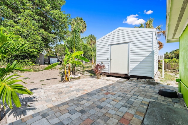 5203 S Indian River Dr, Fort Pierce, FL 34982 - view of patio featuring a storage shed