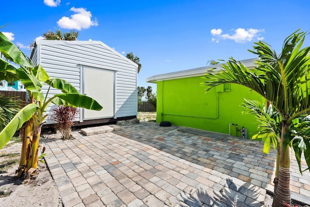 5203 S Indian River Dr, Fort Pierce, FL 34982 - view of patio featuring a shed