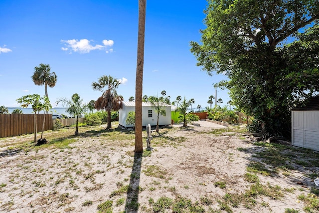 5203 S Indian River Dr, Fort Pierce, FL 34982 - fenced backyard with an outbuilding
