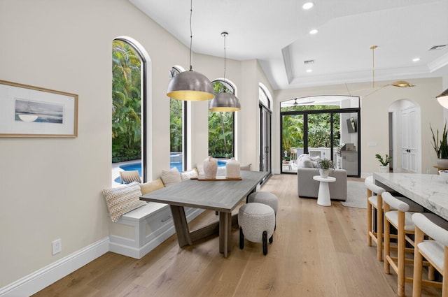 17865 Monte Vista Dr, Boca Raton, FL 33496 - dining space featuring arched walkways, light wood-style flooring, and recessed lighting
