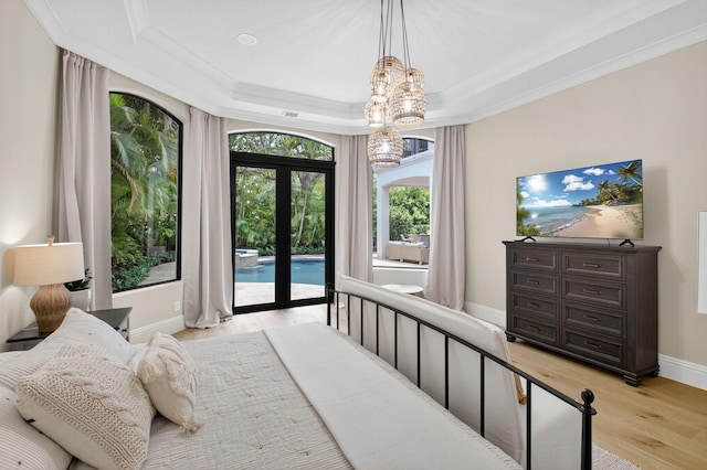 17865 Monte Vista Dr, Boca Raton, FL 33496 - bedroom with access to exterior, light wood-style floors, a chandelier, a tray ceiling, and crown molding