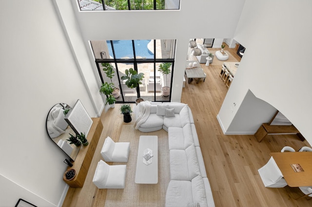 17865 Monte Vista Dr, Boca Raton, FL 33496 - living area featuring wood finished floors, healthy amount of natural light, and a high ceiling