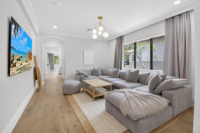 17865 Monte Vista Dr, Boca Raton, FL 33496 - living room with arched walkways, crown molding, light wood finished floors, plenty of natural light, and recessed lighting