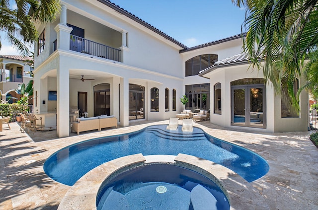 17865 Monte Vista Dr, Boca Raton, FL 33496 - rear view of house with a balcony, french doors, outdoor lounge area, and a patio
