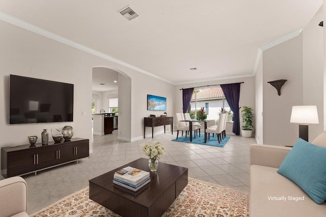 879 SW Pebble Ln, Palm City, FL 34990 - living area with light tile patterned flooring, arched walkways, and ornamental molding