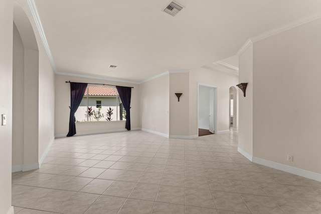 879 SW Pebble Ln, Palm City, FL 34990 - unfurnished room featuring arched walkways, crown molding, and light tile patterned floors