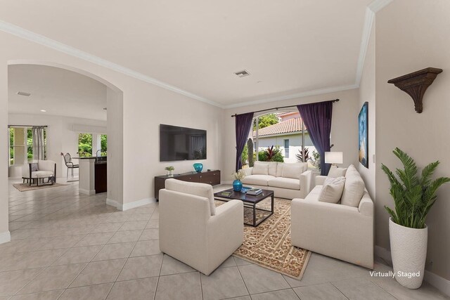 879 SW Pebble Ln, Palm City, FL 34990 - living area with arched walkways, healthy amount of natural light, crown molding, and light tile patterned flooring