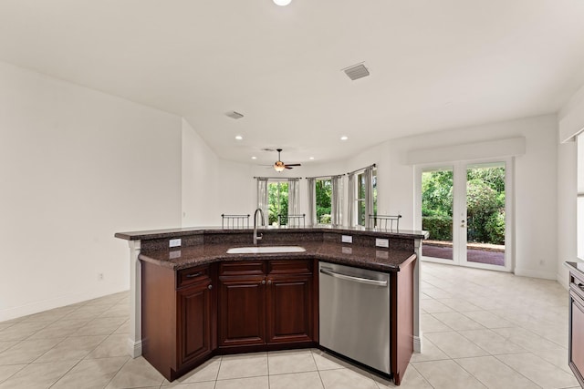 879 SW Pebble Ln, Palm City, FL 34990 - kitchen with dishwasher, light tile patterned floors, recessed lighting, a ceiling fan, and a center island with sink