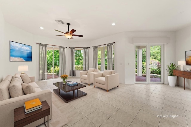 879 SW Pebble Ln, Palm City, FL 34990 - living area featuring light tile patterned flooring, ceiling fan, and recessed lighting