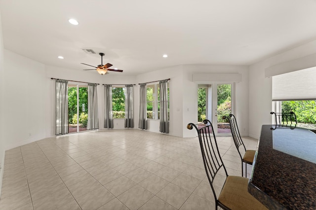 879 SW Pebble Ln, Palm City, FL 34990 - living area featuring light tile patterned floors, recessed lighting, and a ceiling fan