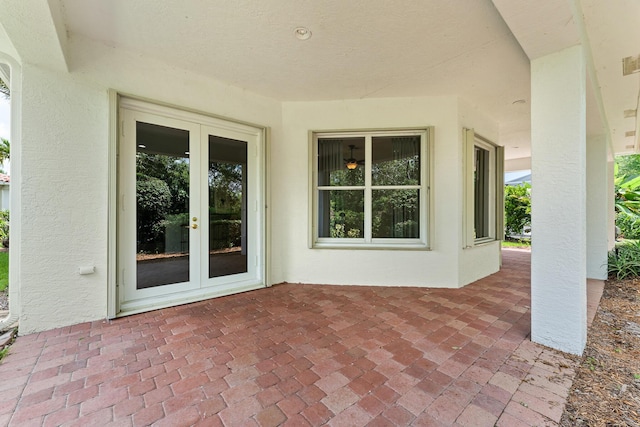 879 SW Pebble Ln, Palm City, FL 34990 - view of patio featuring french doors